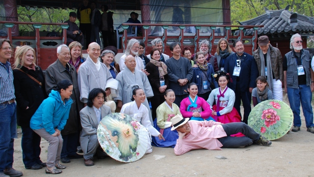Group photo of the visiting international ceramic artists along with traditional performers (and Martha).  Photo by Steebu